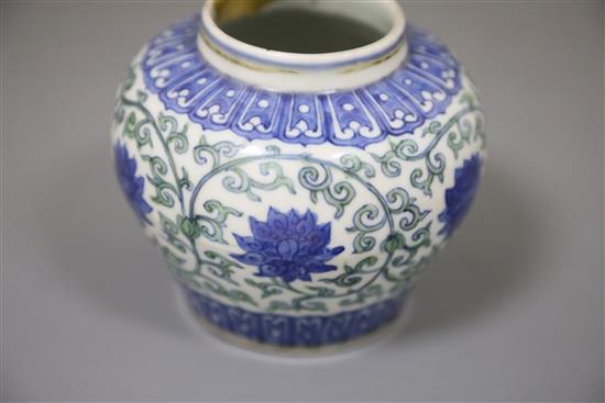 A rare Chinese doucai lotus flower jar, Wanli six character mark and probably of the period, (1573-1619), H. 9.5cm, D. 10.8cm, later